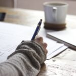 ACAP Business Math Practice — Alabama Guide 2 Person studying at desk